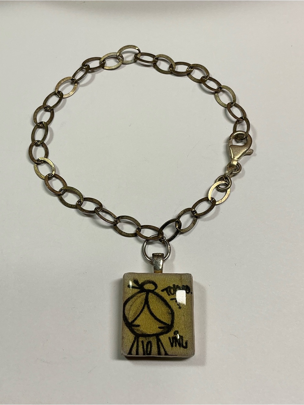 Sterling  Bracelet with a Scrabble Letter U Tile W/ ink style doodle & Toyko. 8”